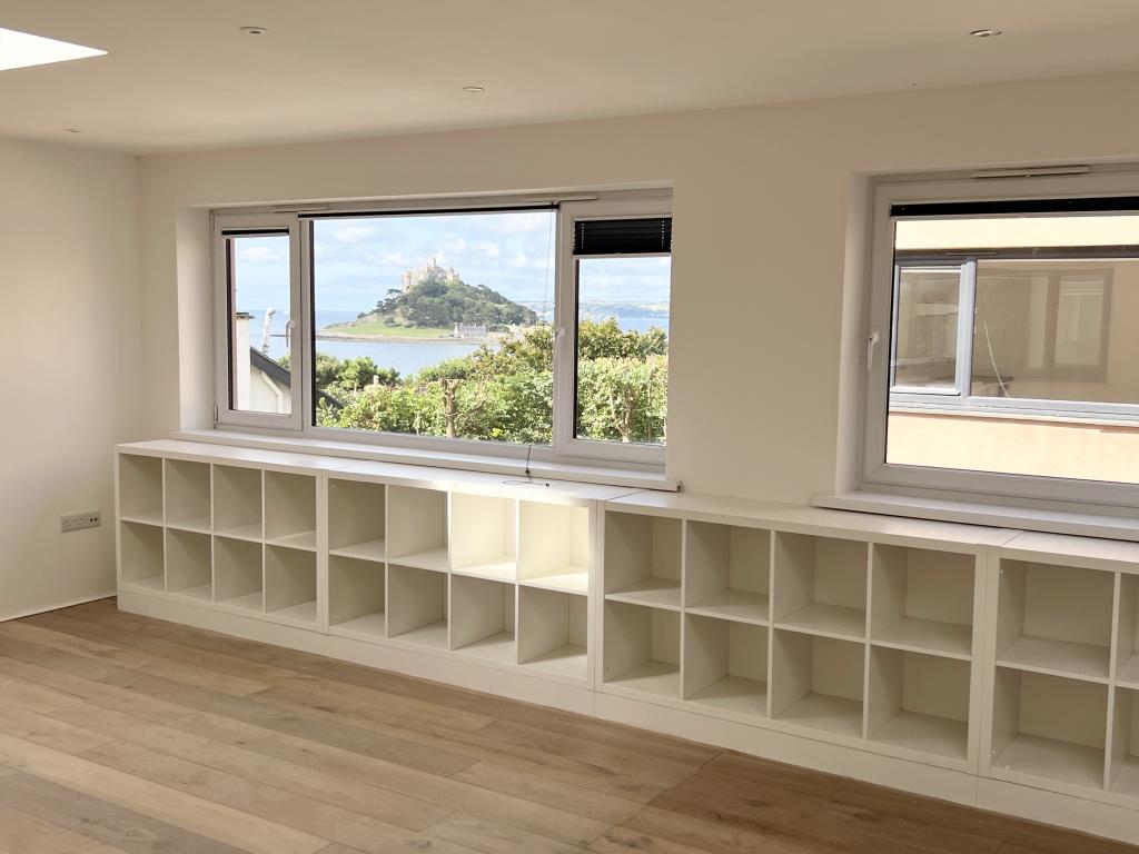 Lot: 125 - DETACHED HOUSE WITH VIEWS ACROSS MOUNT'S BAY AND ST MICHAEL'S MOUNT - Living room showing view
